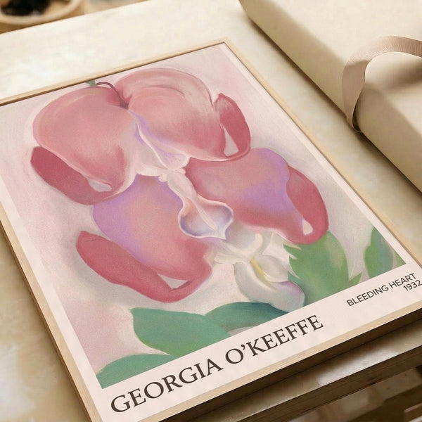 Sensual bleeding heart flower study with layered petals in deep rose and soft pink against sage green foliage, vintage Art Nouveau framed print.