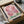 Contemplative botanical artwork of bleeding heart blooms with flowing petals in cream, lavender, and pink tones in elegant Art Nouveau style.