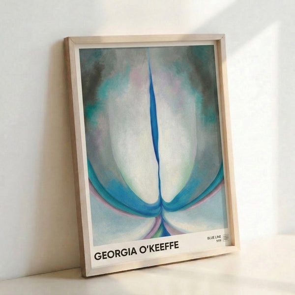 O'Keeffe-inspired abstract flower with gentle curves rendered in soft green and pale blue, a minimalist interpretation of natural forms displayed as framed wall art.