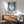 Contemporary abstract flower poster featuring flowing forms in muted cream, green, and teal tones, embodying quiet sensuality and minimalist sophistication.