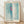 Abstract art print featuring flowing curved forms in soft pink, pale green, and teal tones creating a serene, sensual composition on a framed wall poster.