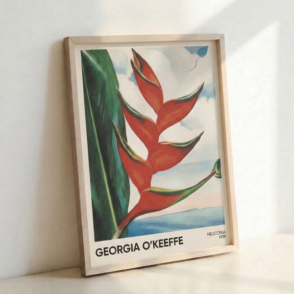 Georgia O'Keeffe's iconic heliconia artwork with soft, flowing organic forms in warm and cool tones—deep reds, forest greens, and golden yellows—displayed as a framed wall art piece.