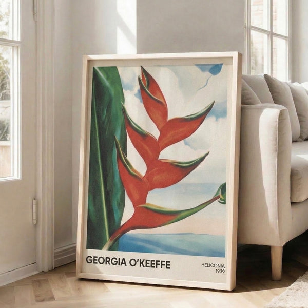 Serene Art Nouveau-inspired floral print depicting a heliconia plant with sensual curves in a cream, deep red, and forest green palette, hung as vintage wall decor.