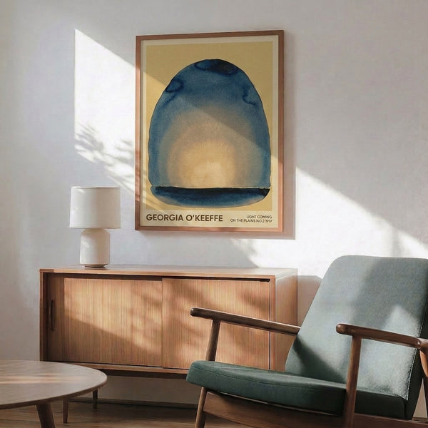 Abstract modern poster displaying a luminous pale yellow dome emerging from cool slate blue and teal gradient layers, evoking quiet meditative light.