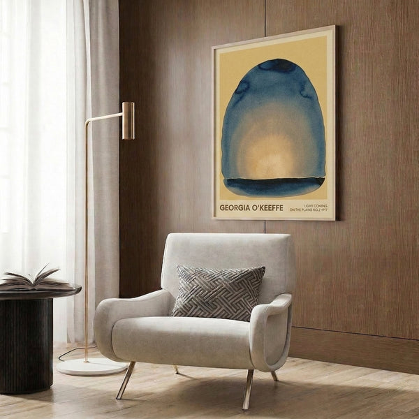Framed contemporary art print with a soft cream dome shape floating in layers of deep teal and pale blue, capturing serene atmospheric light.