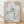 Watercolor iris flower with delicate pale purple petals and soft yellow stamen, rendered in serene Art Nouveau style on framed poster.