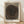 Abstract minimalist framed poster featuring a spiral wood grain composition in warm beige, taupe, and brown tones with charcoal accents, creating a meditative and organic aesthetic on a gallery wall.