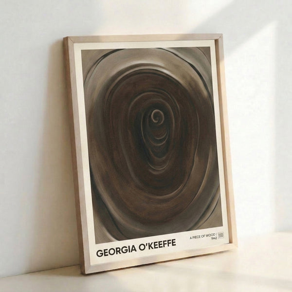 Minimalist wall art depicting swirling wood grain forms in soft beige and charcoal, evoking a calm, meditative mood through organic shapes and subtle earth-tone palette.