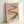 Framed modern abstract artwork with sensual pink and sage tones creating a meditative focal point in soft, organic brushwork.