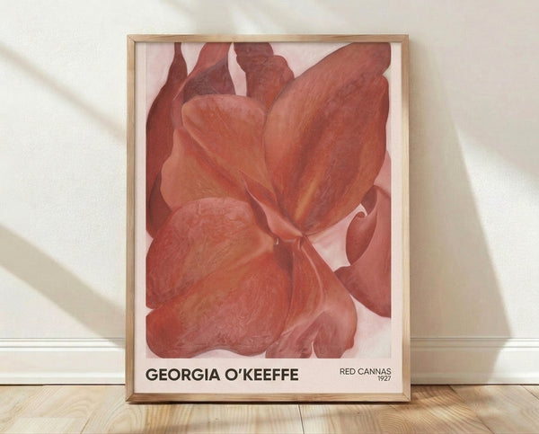 Deep red and coral canna flower petals unfold in sensual, intimate abstraction, a framed vintage masterpiece in warm cream and burgundy tones.