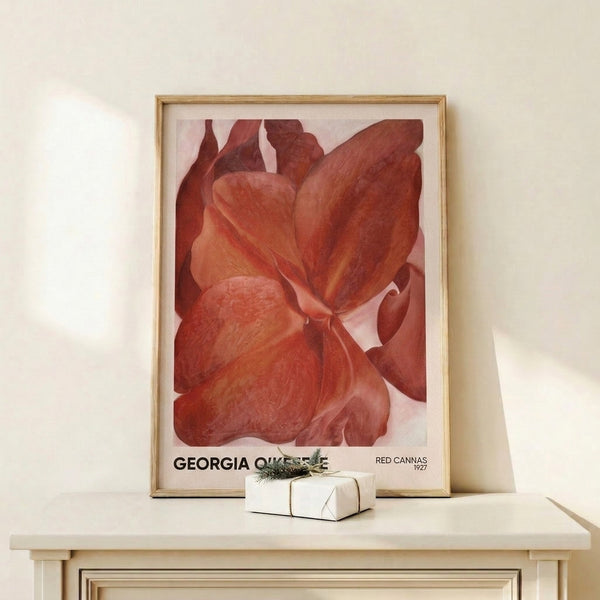 Sensual arrangement of deep red and blush-pink canna blooms in soft focus, creating a dreamy, introspective mood in framed gallery art.