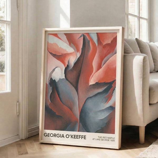 Abstract maple leaf artwork rendered in luxurious deep reds, burgundy, and cream with slate blue shadows, presented as a framed poster that evokes quiet introspection and bold form.
