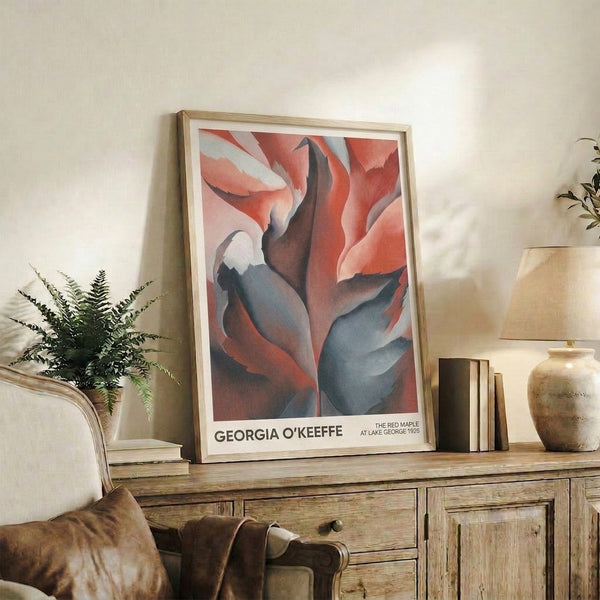 Vintage-style art print of an abstracted red maple displayed as a framed poster, with rich burgundy, pale pink, and slate blue tones creating a sensual and contemplative visual experience.