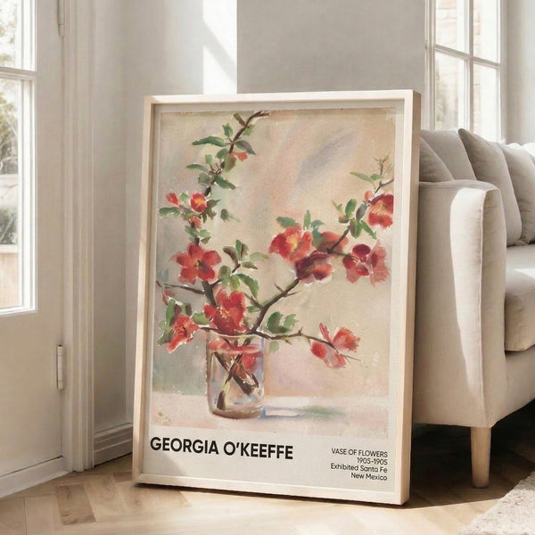 Soft impressionist floral wall art print with red and gold blossoms cascading from a cream vase, rendered in gentle watercolor brushstrokes.