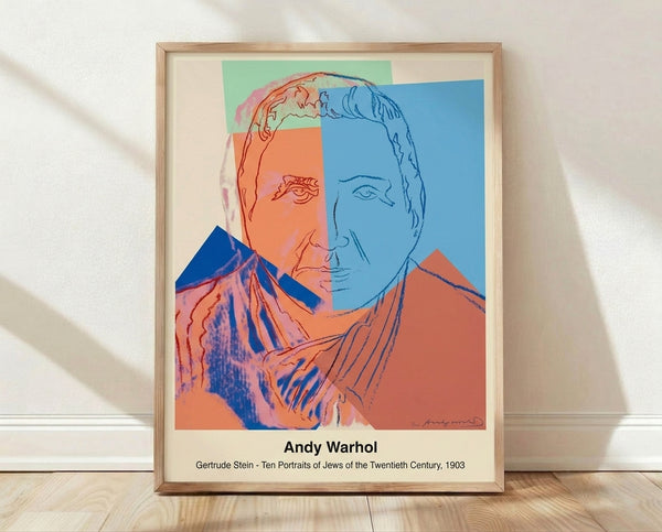 Pop art portrait of Gertrude Stein in bold cyan, magenta, and yellow tones on black and white background, framed poster on wall.
