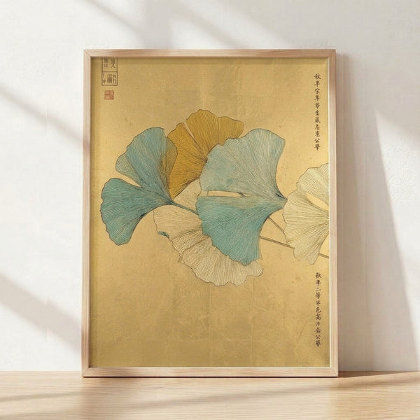 Japanese woodblock print of delicate ginkgo leaves in soft sage green and ochre tones on a cream background, evoking serene botanical study.