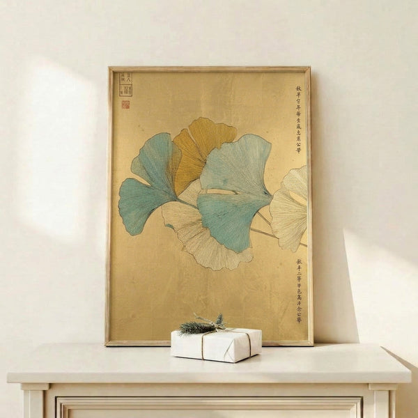 Framed art print featuring fan-shaped ginkgo leaves rendered in pale yellow and muted green, inspired by traditional Japanese woodblock techniques.