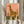Watercolor giraffe art print featuring warm coral and cream palette with dark olive botanical elements, modern minimalist style evoking a peaceful savannah scene.
