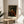 Girl's portrait in classical impressionist style housed within a painted frame, featuring warm ochre and brown palette with intimate, elegant atmosphere.