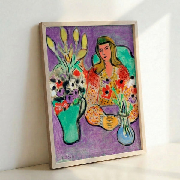 Watercolor-style framed poster depicting a girl with blooming anemone flowers set against a bold purple backdrop.