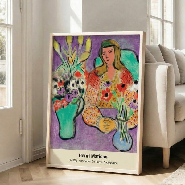 Modern minimalist framed artwork depicting a serene girl among vibrant anemone flowers rendered in purple, red, and green hues.