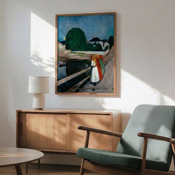 Framed poster of the classic Girls On The Bridge artwork by Edvard Munch, depicting figures in silhouette on a pier with water landscape, characterized by expressive line work and introspective, somber mood.