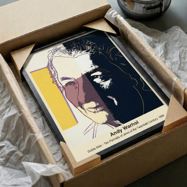 Bold pop art wall print showing a simplified female portrait in electric color—magenta, cyan, yellow—with striking black lines and Warhol's characteristic style.