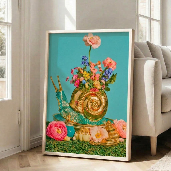 Coquette-inspired floral poster showcasing a snail and blooming flowers in luxurious gold, coral, and turquoise tones against soft cream background, displayed as framed wall art.