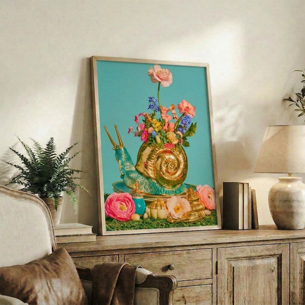 Whimsical boho artwork of a delicate snail among vibrant pink and purple flowers in a decorative vase, painted in dreamy gold and turquoise hues, framed as home decor.