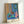 Cheerful abstract composition with a stylized goldfish and sculptural shape rendered in bright blue, coral, and green on white background, framed Matisse-inspired print.
