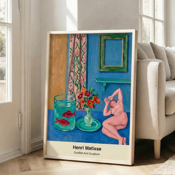 Matisse-style framed poster displaying a playful goldfish and geometric sculpture form in vivid blue, coral, green, and ochre, modern minimalist wall decor.