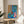 Bold abstract framed art featuring an animated goldfish and sculptural element in vibrant blues and warm coral tones, contemporary cutout-style wall print.