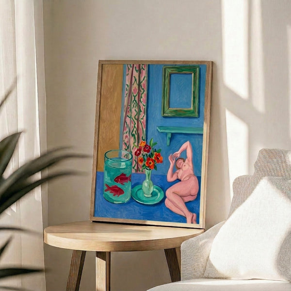 Bold abstract framed art featuring an animated goldfish and sculptural element in vibrant blues and warm coral tones, contemporary cutout-style wall print.