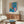 Playful abstract framed print showcasing a colorful goldfish and sculptural form in bold blues, coral, and green hues, contemporary Matisse-inspired wall art.