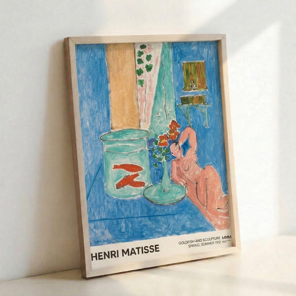 Framed impressionist wall art depicting an intimate domestic scene: goldfish bowl, blooming flowers, reclining woman, and sculpture in harmonious palette of blue and pink hues.