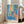 Matisse 1912 artwork in muted, sophisticated colors—serene goldfish and sculptural forms arranged with a contemplative woman and florals in an art nouveau sensibility.