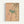 Japandi art print showing a naturalistic bird among cherry blossoms and foliage in soft peach, sage, and neutral tones with traditional woodblock aesthetic.