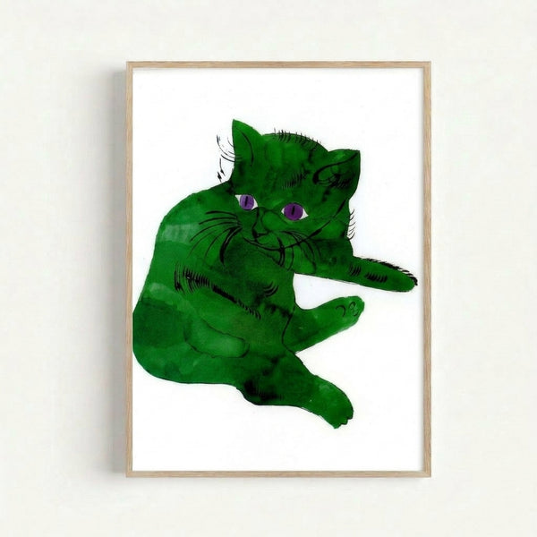 Framed wall art displaying a stylized cat face rendered in bright green tones with graphic, simplified forms characteristic of modern pop art.