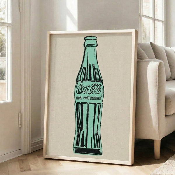 Framed poster featuring a vivid green Coca-Cola bottle rendered in pop art style, eye-catching modern artwork with bold color blocking.