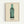 Framed modern art print displaying a stylized green beverage bottle in pop art style with stark black and gray accents, celebrating iconic commercial imagery.