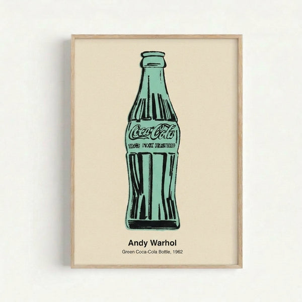 Framed modern art print displaying a stylized green beverage bottle in pop art style with stark black and gray accents, celebrating iconic commercial imagery.
