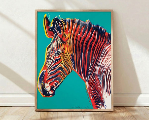 Pop art style Grevy's zebra portrait with bold, vibrant colors and high-contrast striping, framed as a modern art print on a wall.