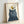 Black cat and golden bird line drawing on cream poster with folk art charm, navy and gold accents create whimsical, lighthearted wall décor.