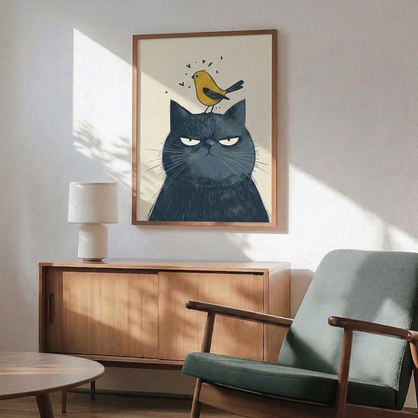 Whimsical framed poster of a grumpy charcoal cat facing a golden bird, minimalist line art with navy and cream, folk art inspired décor.