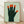 Bauhaus-style poster featuring an abstract hand with five faces integrated into the fingers, rendered in sage green, forest green, burnt orange, and cream on a minimalist composition.