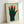 Contemporary minimalist poster of an abstract hand with five integrated faces, created in Bauhaus aesthetic using sage green, forest green, and warm accent colors.