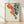 Framed vintage-style poster featuring three hanging Chinese lanterns with decorative fringe in cream, rust orange, navy, and forest green tones, evoking serene Japandi aesthetics.