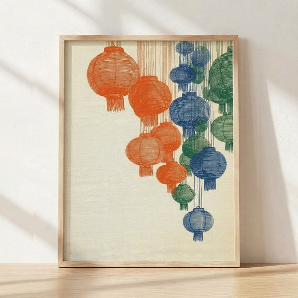 Framed vintage-style poster featuring three hanging Chinese lanterns with decorative fringe in cream, rust orange, navy, and forest green tones, evoking serene Japandi aesthetics.
