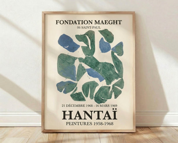 Abstract vintage poster with organic brush strokes in cream, teal, and steel blue tones, framed on wall as contemplative modernist art.