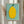 Framed poster of a delightful yellow fruit figure with dark green foliage detail, cheerful and warm minimalist aesthetic ideal for kitchen or children's spaces.